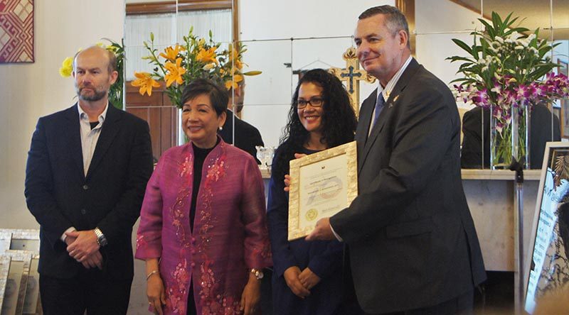 Major Paul Rosenzweig (ret’d), right, receives a Philippines diplomatic relations award from the Philippine Ambassador to Australia (second from left). Image supplied by Philippine Embassy, Canberra