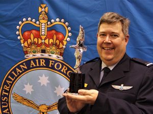 Pilot Officer (AAFC) Dennis Medlow, with his Hoinville Award trophy. Image by Flying Officer (AAFC) Paul Rosenzweig.