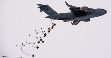 A RAAF C-17A airdrops supplies at Davis research station in Antarctica. Photo by Barry Becker, Australian Antarctic Division.