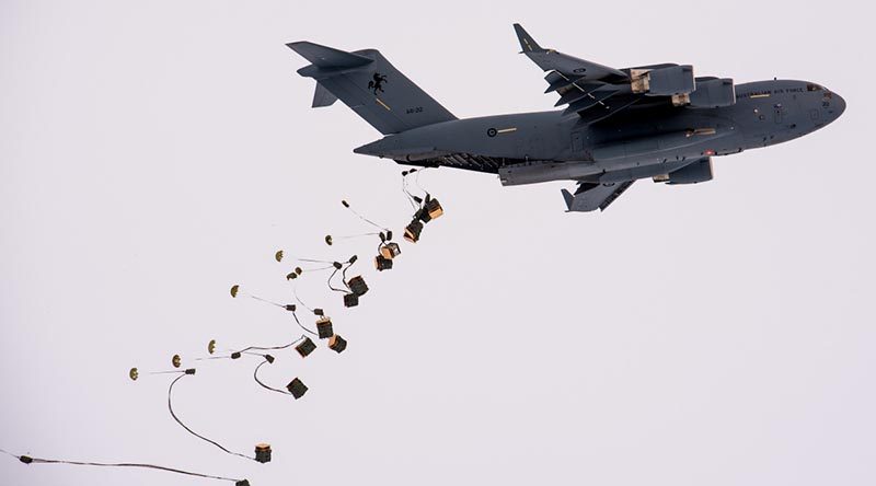 A RAAF C-17A airdrops supplies at Davis research station in Antarctica. Photo by Barry Becker, Australian Antarctic Division.