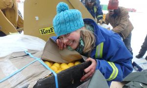 Davis research station Chef Kerryn Oates is happy to see fresh fruit after a long winter. Photo Tony D’Amico, Australian Antarctic Division.