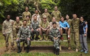The Bush Tucker Man retired Major Les Hiddins with Australian, US and Chinese soldiers and Marines. Photo by Leading Seaman Jake Baidor.