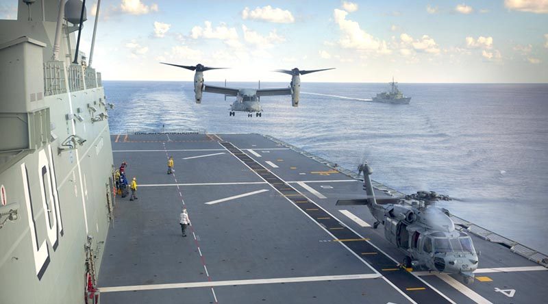 A United States Marine Corps MV-22 Osprey and a United States Navy Seahawk helicopter from USS Bonhomme Richard conduct deck landings on HMAS Adelaide, with HMAS Darwin in the background during Indo-Pacific Endeavour 2017. Photo by Petty Officer Andrew Dakin.