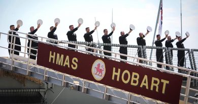 HMAS Hobart’s ship's company 'cheer ship' during her commissioning at Garden Island, Sydney. Photo by Able Seaman Bonny Gassner.