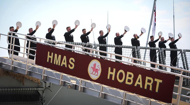 HMAS Hobart’s ship's company 'cheer ship' during her commissioning at Garden Island, Sydney. Photo by Able Seaman Bonny Gassner.
