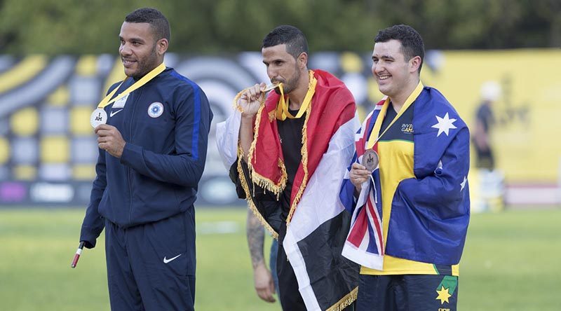 Royal Australian Air Force officer and Australian Invictus Games athlete Pilot Officer Nathan Parker (right) with his bronze medal for the 100 meter sprint competition at York University athletics track as part of the 2017 Invictus Games in Toronto, Canada. Photo by Leading Seaman Jason Tuffrey.