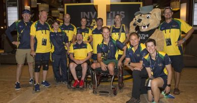 Some of the Australian Invictus Games athletes with the Invictus Games mascot at the Athletes Village, Toronto, Canada.