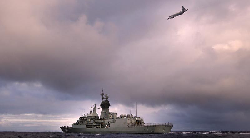 HMAS Perth is overflown by a RNZAF P-3K Orion. Photo by Able Seaman Nicolas Gonzalez.