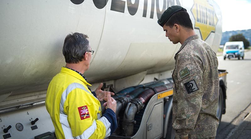 Private Lawrance Prasad from 2CSSB, Linton, receives familiarisation training from Steve Randall of Linfox Logistics NZ, before starting emergency fuel deliveries. NZDF photo.