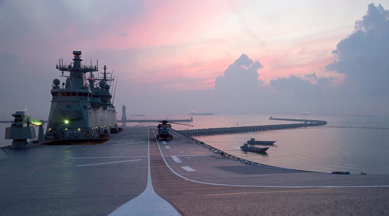 Landing craft depart HMAS Adelaide before sunrise, to conduct humanitarian-aid and disaster-response training with the Singapore Armed Forces in Changi Bay, Singapore, during Indo Pacific Endeavour 2017. Photo by Leading Seaman Peter Thompson.