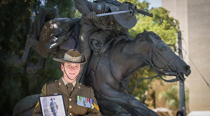 Australian Army Sergeant Janine Fabre visits the Park of the Australian Soldier in Be’er-Sheva ahead of the commemoration of the centenary of the Battle of Beersheba in Israel, with a photo of her great uncle who participated in the famous charge. Photo by Corporal Nunu Campos.