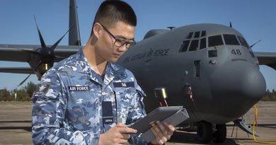 Flying Officer Josh Suh, Logistics Officer with Headquarters Air Mobility Group - Capability Development Cell, connects to the Ka-Band SATCOM during a technology-demonstrator trial. Photo by Corporal David Gibbs.