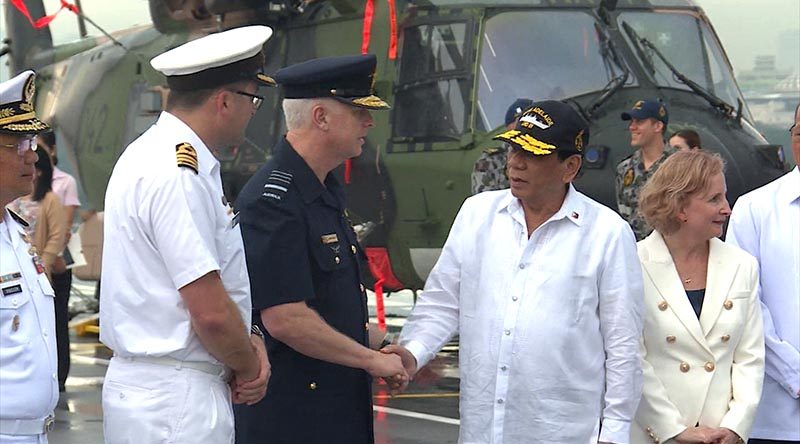 Philippines President Rodrigo Duterte is greeted by Australia's Chief of Defence Force Air Chief Marshal Mark Binskin during a visit aboard HMAS Adelaide in Manila. Photo by Leading Seaman Peter Thompson.