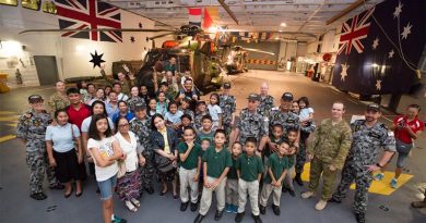 Crew from HMAS Adelaide pose with children and staff from the Amazing Grace Refuge Home, in Dinalupihan, Philippines during a visit to HMAS Adelaide while alongside in Subic Bay. Photo by Leading Seaman Peter Thompson.