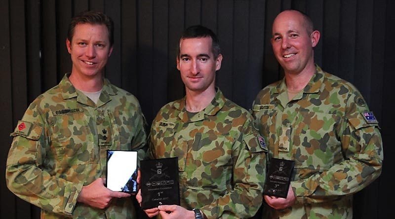 Lieutenant Colonel Glen Billington 19th Chief Engineer Works accepts 2nd prize on behalf of Major Tim Napper, winner Signaller Travis Quinn and 3rd place-getter Signaller James Martin, 7th Signal Regiment.