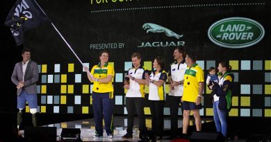 Australian team co-captains Captain Emma Kadziolka and Sergeant Peter Rutland and their families display the Invictus Games Flag after officially accepting it on behalf of Sydney, during the 2017 closing ceremony in Toronto. Photo by Corporal Mark Doran.