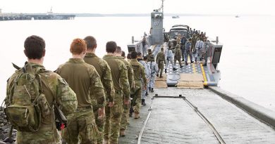 Australian soldiers and Malaysian Armed Forces personnel step aboard an LHD landing craft from HMAS Adelaide during a visit to Port Klang, Malaysia, for Indo Pacific Endeavour 2017.