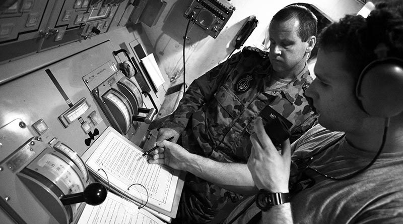 Mentoring below decks on HMAS Melbourne, Persian Gulf. Photo by Brian Hartigan, 2012.