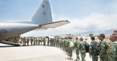 Troops from Timor Leste and Papua New Guinea file into a Royal New Zealand Air Force C-130 Hercules on their way to New Zealand for exercise Southern Katipo. NZDF photo.