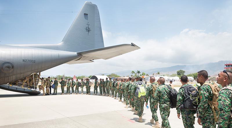 Troops from Timor Leste and Papua New Guinea file into a Royal New Zealand Air Force C-130 Hercules on their way to New Zealand for exercise Southern Katipo. NZDF photo.