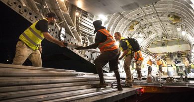 RAAF personnel are assisted by Department of Foreign Affairs and Trade, Palladium workers and Vanuatu locals to unload Australian Aid supplies from a C-17 Globemaster at Santo-Pekoa International Airport in Vanuatu as part of Operation Vanuatu Assist 2017. Photo by Leading Seaman Jake Badior.