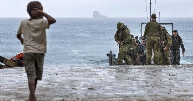 A local boy on Pentecost Island in Vanuatu greets sailors and soldiers from HMAS Choules during Operation Vanuatu Assist 2017. Photo by Able Seaman Jake Badaior.