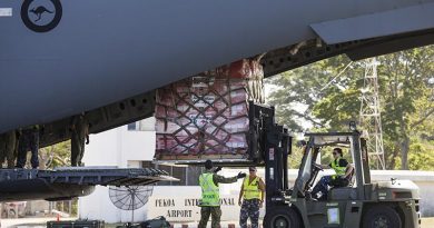 RAAF Sergeant Matt Jones (centre) directs Leading Aircraftwoman Laura Gale as she removes a pallet of Australian Aid supplies from a C-17 Globemaster in Vanuatu during Operation Vanuatu Assist 2017. Photo by Leading Seaman Jake Badior.