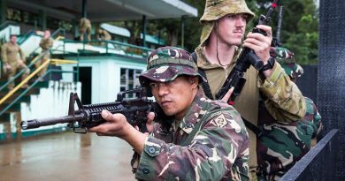 Philippine Army soldier Corporal Dennis Nalugon conducts urban-combat training with Australian soldier Lance Corporal Adam Seaman from the 3rd Brigade, at Capinpin, Philippines, as part of Operation Augury. Photo by Corporal Kyle Genner.