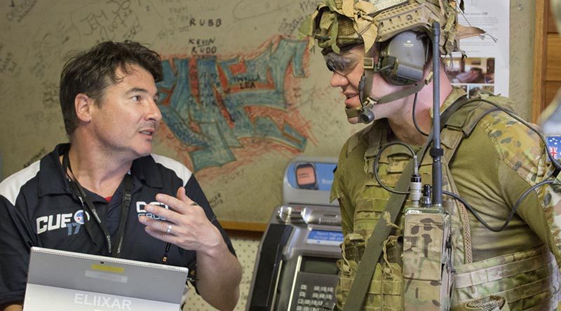 A Defence Science and Technology employee debriefs a soldier after an activity during the 2017 Contested Urban Environment Strategic Challenge at the old Adelaide Dental Hospital, South Australia. Photo by Corporal Craig Barrett.