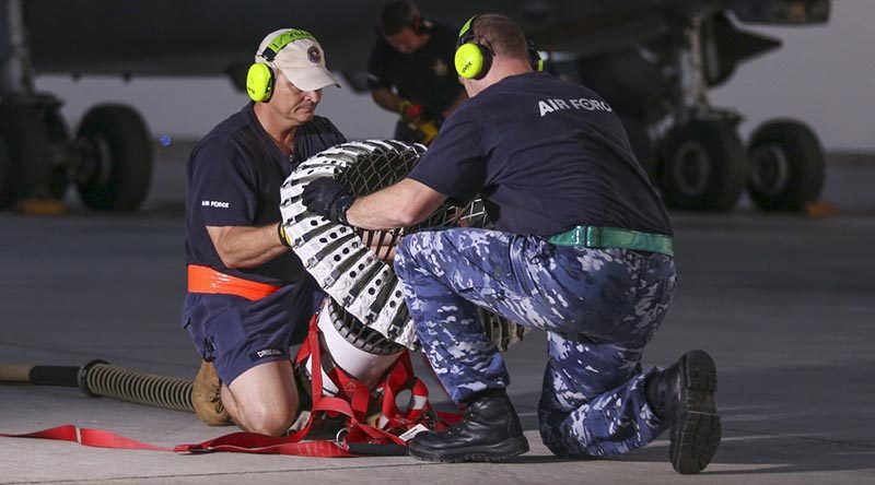 RAAF technicians conduct an inspection on a KC-30A drogue. Photo by Corporal Brenton Kwaterski.