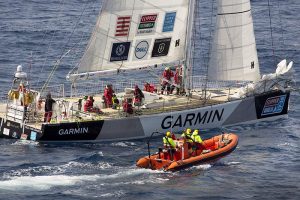 A Zodiac from MV Stoker approaches CV 22 Garmin, before transferring an ill crew member from the round-the-world racer. Photo by Chief Petty Officer Damian Pawlenko.