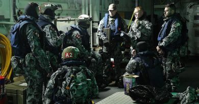 Chief Petty Officer Thomas Whitworth briefs HMAS Melbourne's boarding party during a tri-lateral exercise with United States and Republic of Korean Navies off the Korean coast. Photo by Able Seaman richard Cordell.