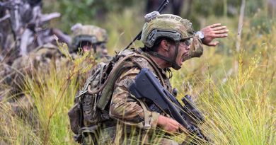 An Australian soldier from 8th/9th Battalion, Royal Australian Regiment, 'communicates effectively in a high-pressure tactical situation'. Photo by David Said.