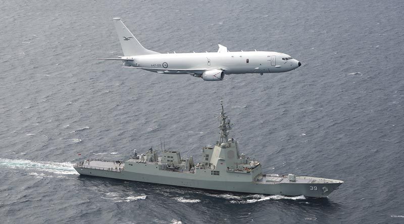 A RAAF P-8A Poseidon supports sea trials for NUSHIP (now HMAS) Hobart in the Gulf St Vincent off the coast of Adelaide. Photo by Corporal Craig Barrett.