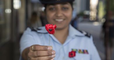 Corporal Jagroop Mangat sells poppies and collects donations in Perth's Hay Street Mall, helping raise money for Legacy. Photo by Leading Seaman Bradley Darvill.