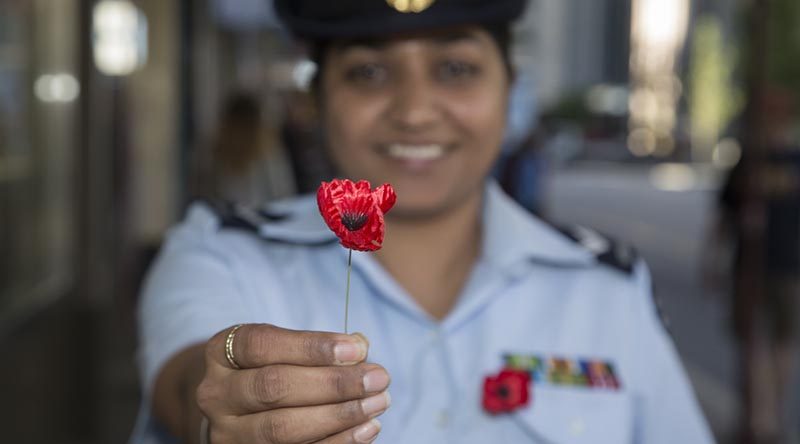 Corporal Jagroop Mangat sells poppies and collects donations in Perth's Hay Street Mall, helping raise money for Legacy. Photo by Leading Seaman Bradley Darvill.