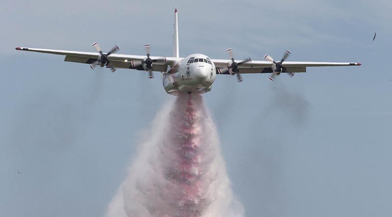 "Thor", a L-382G Hercules firefighting aircraft contracted to the NSW Rural Fire Service from Coulsan, performing a water bombing display. Photo by Corporal David Gibbs.