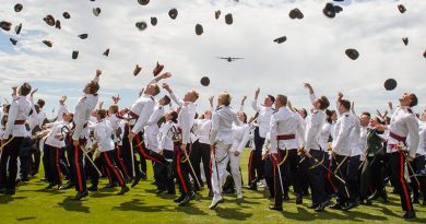 ADFA’s graduating class of 2017 throw their hats in the air to symbolise completion of three years military training and academic studies as a C-130J Hercules flies over in salute. Photo by AHC Studios.
