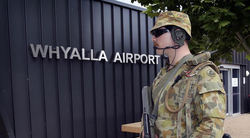 A Royal Military College first class Staff Cadet helps secure Whyalla Airport during a fictional escort mission. Photo by Sergeant W Guthrie.