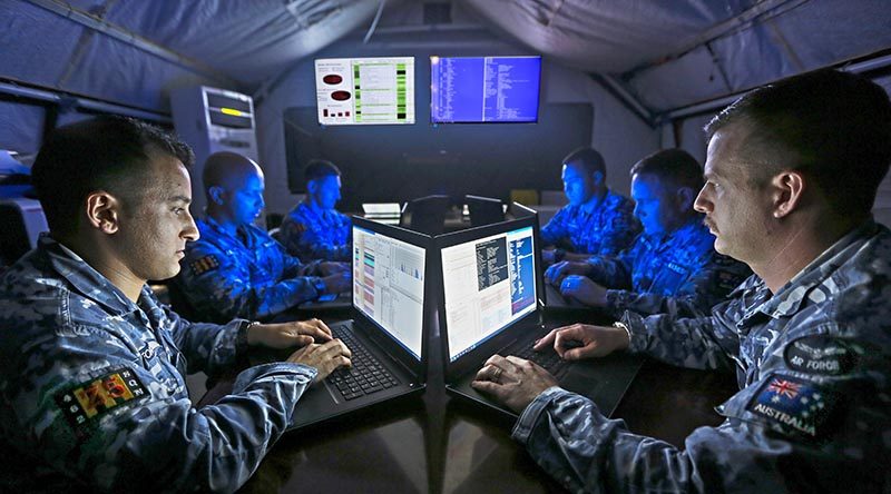 No. 462 Squadron cyberspace security specialists conduct information-assurance activities on deployed mission systems at the main air operating base in the Middle East Region. Photo by Corporal Brenton Kwaterski.