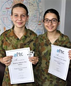 Leading Cadets Ana and Beatriz Ribeiro Dos Santos of No 613 Squadron, AAFC, with certificates awarded by Flight Training Adelaide.