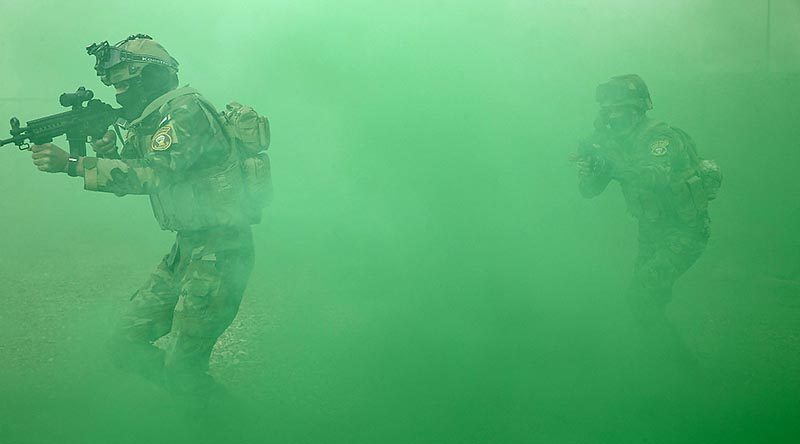 Iraqi Army Rangers storm a building during an Australian-led training activity. Photo by Corporal Steve Duncan.