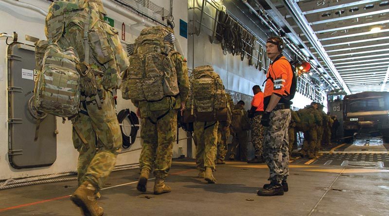 Soldiers from 5 Brigade board one of HMAS Canberra's landing craft as they prepare to leave the ship on completion of Exercise Ocean Raider 2017.