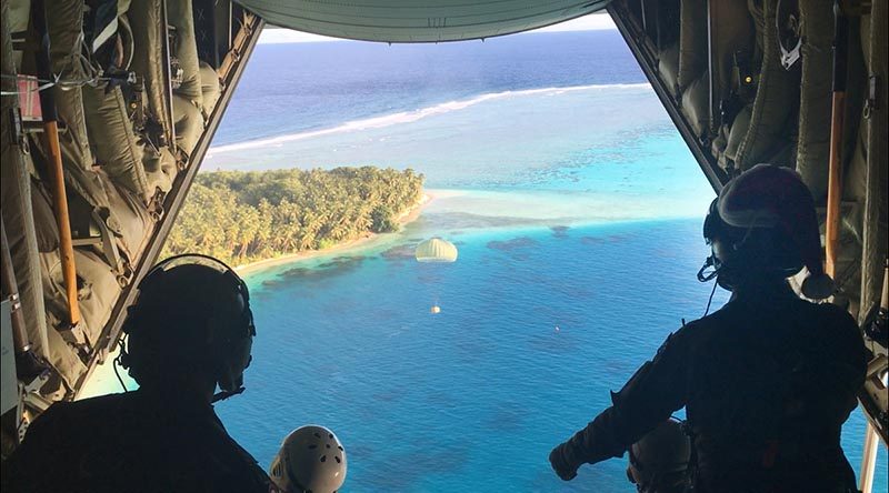 A cardboard container is dispatched from a Royal Australian Air Force C-130J Hercules during Operation Christmas Drop 17. Photo by Eamon Hamilton.