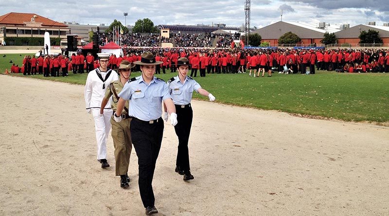 The tri-Service ADFC party departs the stadium after raising the flags to mark the commencement of the 10th Pacific School Games (front to rear): Leading Cadet Lachlan Jenkins (No 604 Squadron, AAFC), Cadet Under Officer Aaron Louch (43 Army Cadet Unit, Warradale Barracks) and Petty Officer Alex White (TS Noarlunga, ANC). The Flag Party Commander was Cadet Corporal Benjamin Grillett (No 617 Squadron, AAFC). Photo by FLGOFF (AAFC) Paul Rosenzweig, HQ 6WG