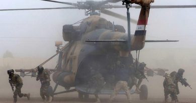 Iraqi Army Rangers disembark from an Iraqi Army MI-17 helicopter during the Rangers' certification activity at the Taji Military Complex, Iraq. Photo by Corporal Steve Duncan.