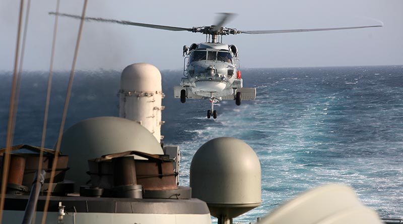 An S-70B-2 Seahawk helicopter comes in for a landing on HMAS Melbourne in the Middle East. Photo by Brian Hartigan.