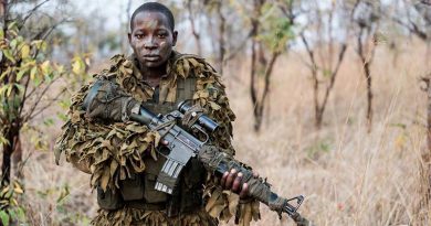 Eighteen-year-old Abigail Malzanyaire, a member of the International Anti Poaching Foundation's Akashinga Program. Photo by Adrian Steirn for Alliance Earth (via IAPF web site).