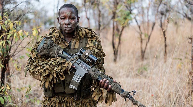 Eighteen-year-old Abigail Malzanyaire, a member of the International Anti Poaching Foundation's Akashinga Program. Photo by Adrian Steirn for Alliance Earth (via IAPF web site).