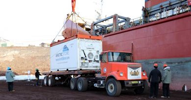 A shipping container with up to 28 tonnes of supplies is hoisted on to a truck driven by a New Zealand Defence Force driver. NZDF photo.